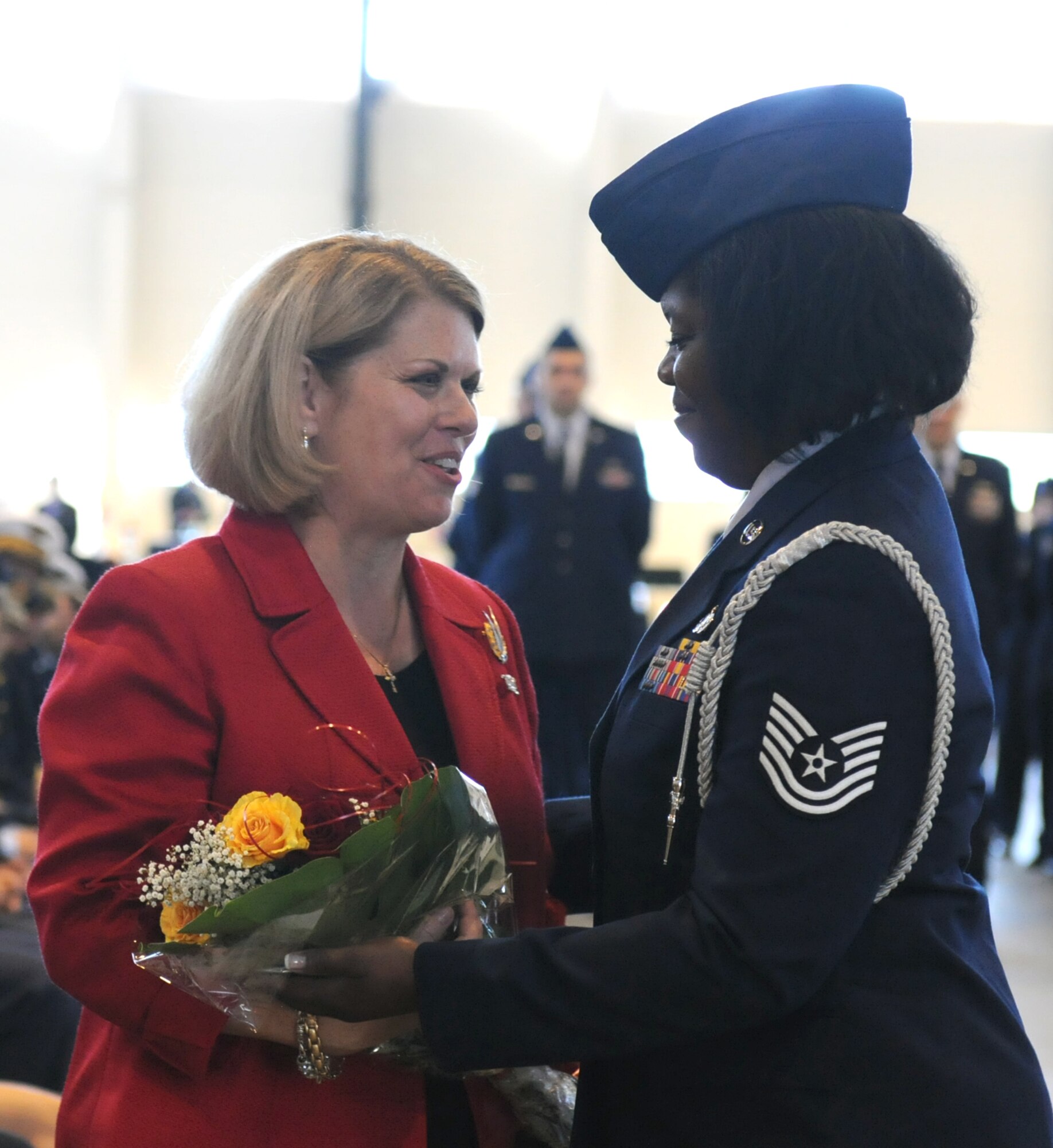 Mrs. Sharon Gorenc, wife of Gen. Frank Gorenc, is presented with a bouquet of flowers during the assumption of command ceremony at Ramstein Air Base, Germany, Aug. 2, 2013. Gen. Frank Gorenc, U.S. Air Forces in Europe and Air Forces Africa commander assumed command of U.S. Air Forces in Europe, Air Forces Africa and Allied Air Command. (U.S. Air Force photo/Airman 1st Class Holly Mansfield)