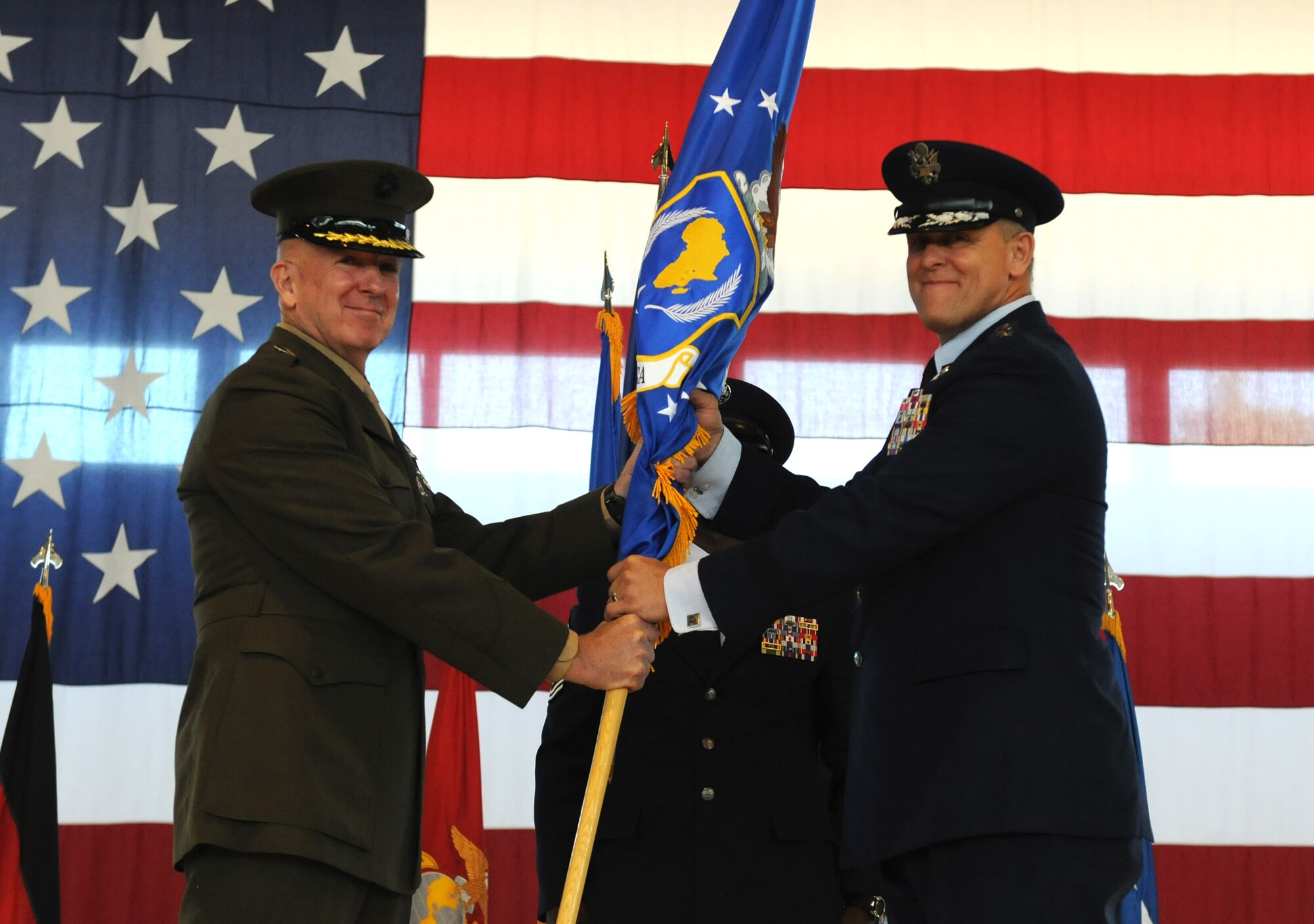 Lt. Gen. Steven A. Hummer, deputy to the commander for military operations, U.S. Africa Command gives Gen. Frank Gorenc the command of U.S. Air Forces Africa during an assumption of command ceremony at Ramstein Air Base, Germany, Aug. 2, 2013. (U.S. Air Force photo/Airman 1st Class Holly Mansfield)