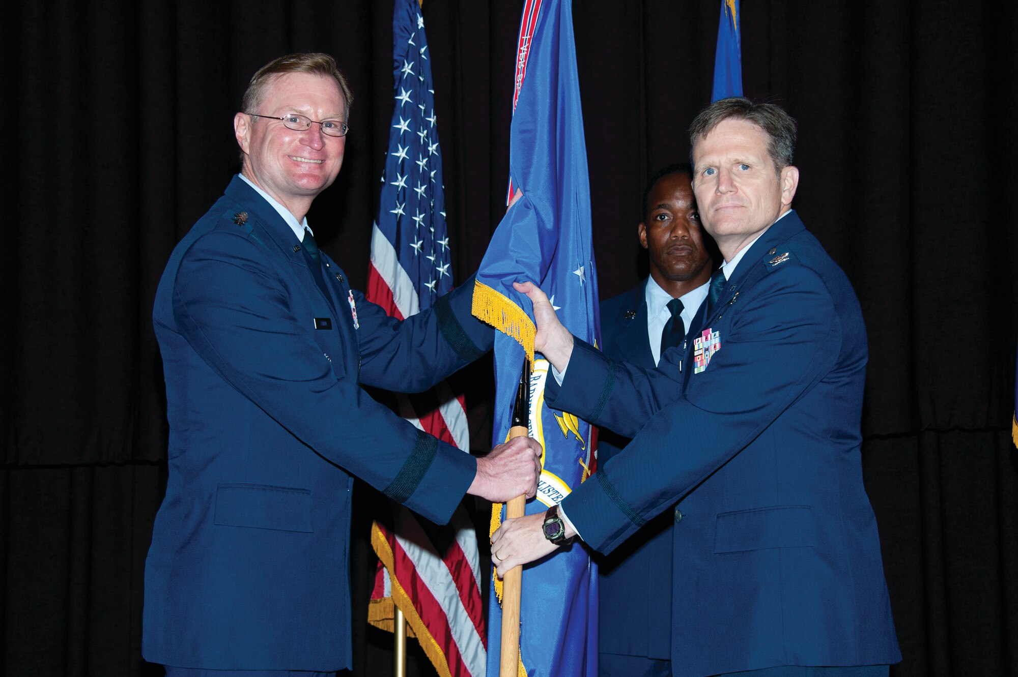 Lieutenant Gen. David Fadok transferred command of the Thomas N. Barnes Center for Enlisted Education to Col. Jefferson Dunn during a change of command ceremony July 24 inside the Air Force Senior Noncommissioned Officer Academy. (U.S. Air Force photo by Melanie Rodgers Cox)