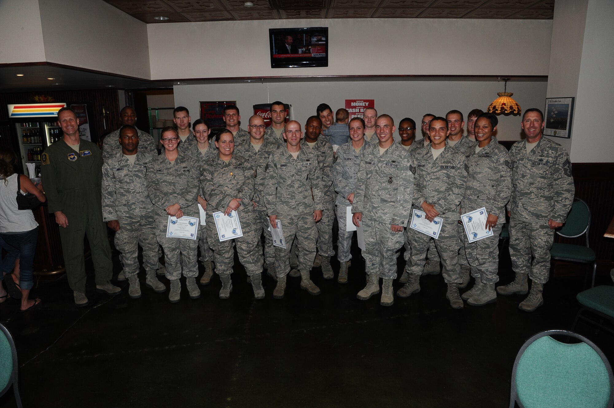 Twenty out of 35 staff sergeant selectees attend the promotion party August 1 at the Columbus Club. This year the selection rate for staff sergeant was 30.2 percent.