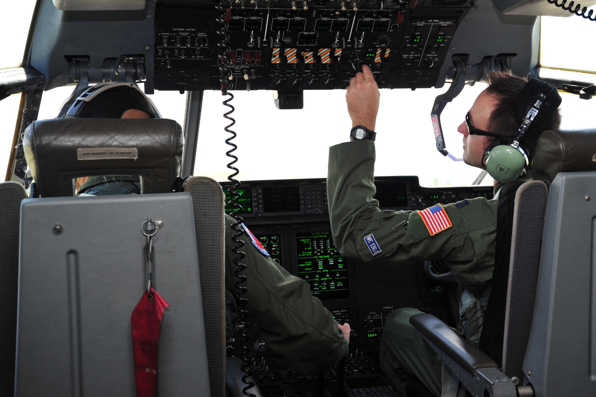 Lt. Col. Kevin McLuen and Capt. Bryan Trottier (right), 53rd Weather Reconnaissance Squadron pilots, fly a WC-130J aircraft through the remnants of Dorian July 29, 2013. The Hurricane Hunters flew a low-level investigation into the tropical wave to gather storm data used by the National Hurricane Center to determine whether Dorian was breaking up or reforming into a more intensified storm. (U.S. Air Force photo/Tech. Sgt. Ryan Labadens)