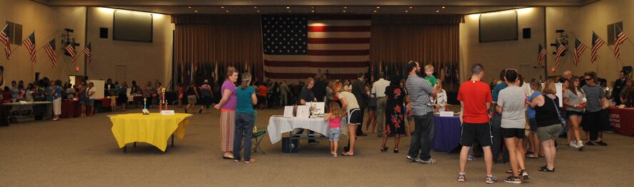 Members of the local community gather at the Airman and Family Readiness Center's annual Back-to-School event on Barksdale Air Force Base, La., July 29, 2013. More than 30 Caddo and Bossier Parish school officials attended the event to showcase and educate parents on the academic and social culture of their schools. (U.S. Air Force photo/Senior Airman Kristin High)



