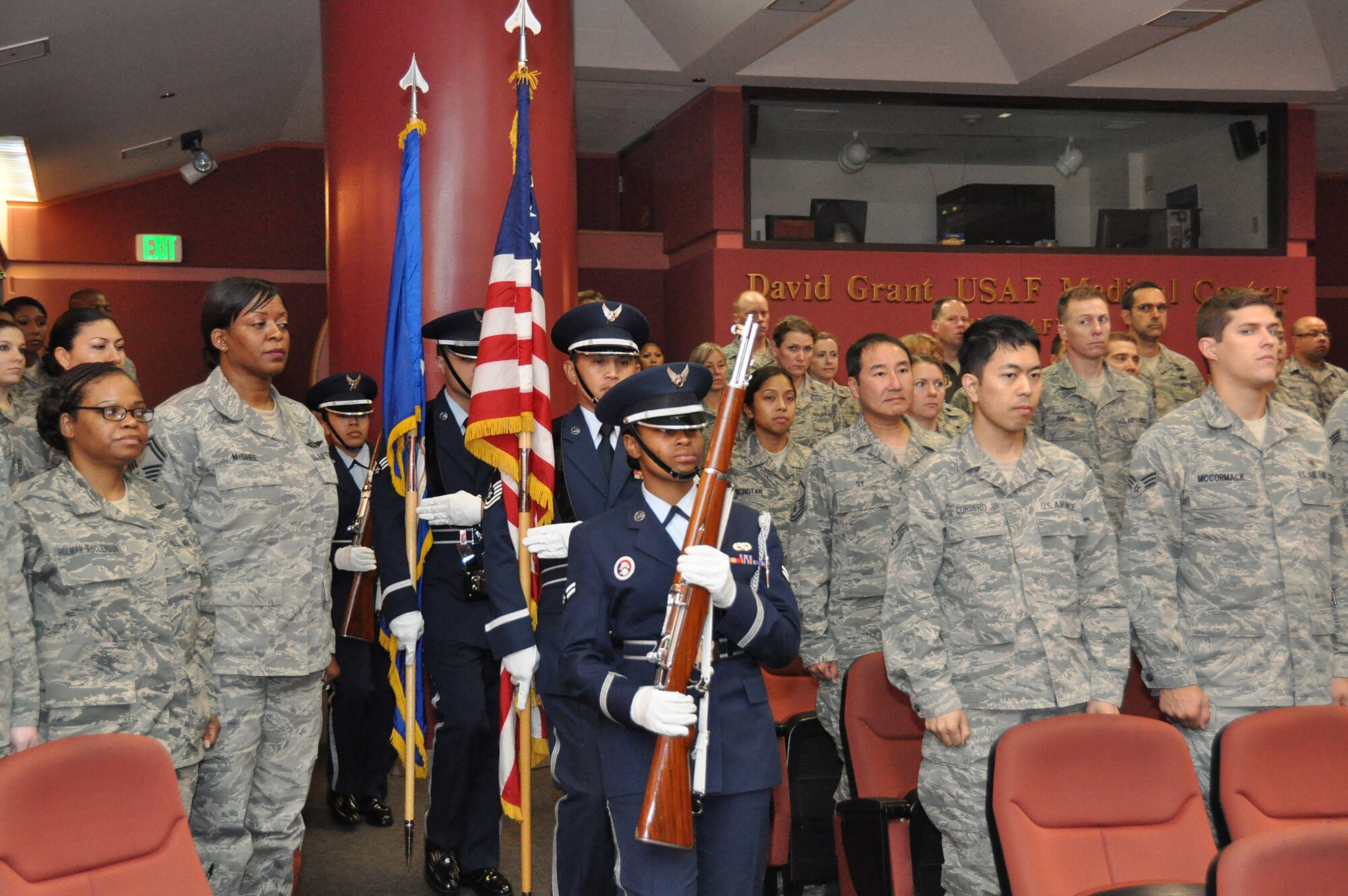 TRAVIS AIR FORCE BASE, Calif. -- Col. Kenneth Furukawa accepts the 349th Aeromedical Squadron guidon from Col. Kurt Lambert, 30th Medical Group commander, during a change of command ceremony held here July 28th. Col. Furukawa, previously the B-flight leader of the physicians flight, took command of the unit from Col. Terese LeFrancois. (U.S. Air Force photo/SMSgt Robert Wade)