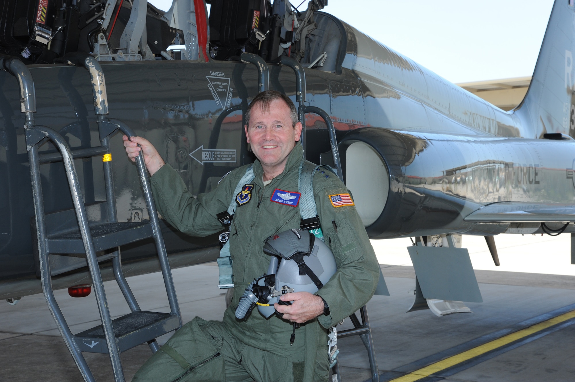 JOINT BASE SAN ANTONIO - RANDOLPH, Texas -- Lt. Gen. Douglas Owens, Air Education and Training Command vice commander, prepares for his last flight in a T-38 jet July 31, 2013, at Joint Base San Antonio-Randolph, Texas. Air Force pilots have a  tradition where they are hosed down with water by their squadron comrades, friends and family upon the completion of their last flight. (U.S. Air Force photo/Rich McFadden)