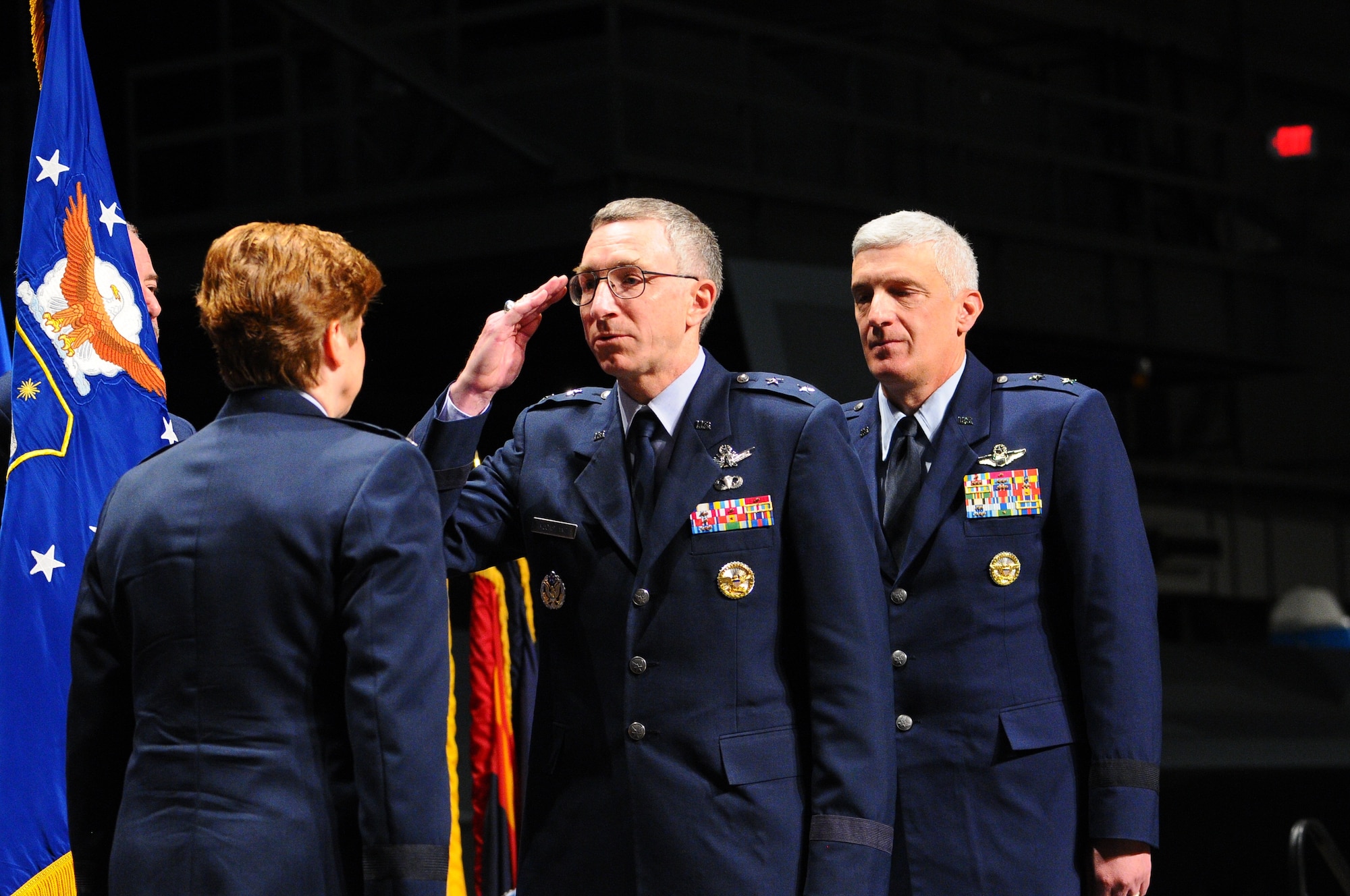 Maj. Gen. McCasland salutes Gen. Wolfenbarger as he passes on the reins of the organizations he has led since May 2011.  McCasland will retire from the Air Force Oct. 1 after 34 years of service. (U.S. Air Force photo by Niki Jahns)