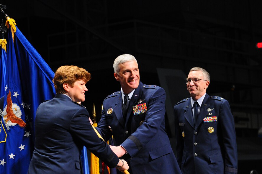 Gen. Janet Wolfenbarger, Air Force Materiel Command commander, hands the guidon of the Air Force Research Laboratory to Maj. Gen. Thomas Masiello, who took over command of the organization July 29 from Maj. Gen. William McCasland. (U.S. Air Force photo by Niki Jahns)