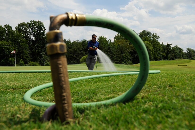 Ben Ellis, The Courses’ at Andrews assistant golf superintendent, performs routine maintenance on the course at Joint Base Andrews, Md., July 31, 2013. The 54-hole course is the only one of its kind within the Department of Defense. It often hosts U.S. heads of state, high-ranking military officials, political leaders and even the President of the United States. (U.S. Air Force photo/ Airman 1st Class Nesha Humes) 
