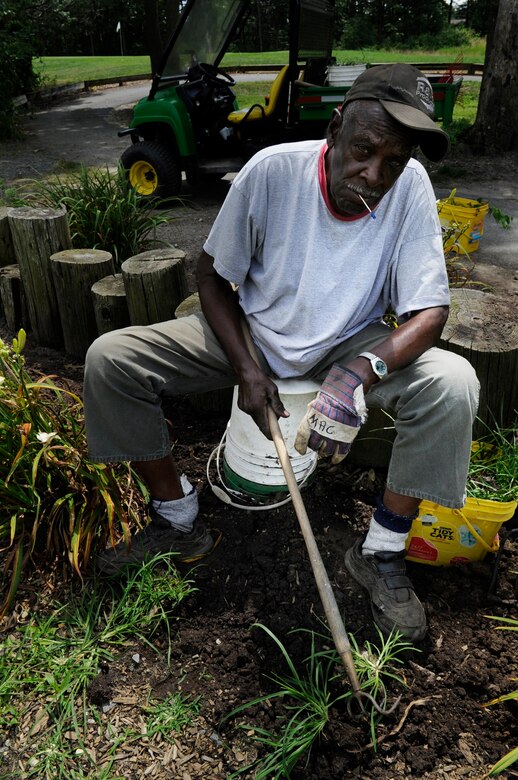 McCombs “Man” Wallace, golf course beautification laborer, weeds out a garden at Joint Base Andrews, Md., July 31, 2013. The Courses at Andrews was named the 2012 Golf Course Program of the Year. (U.S. Air Force photo/ Airman 1st Class Nesha Humes)