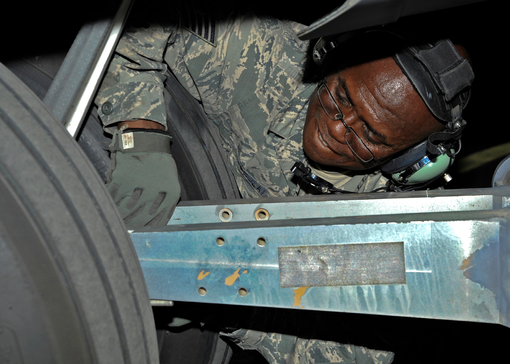 Tech. Sgt. Abdul-Ganeu Abdulai unhooks a C-130 Hercules from a tow truck prior to an engine run at the 379th Air Expeditionary Wing in Southwest Asia, July 29, 2013. Abdulai is a 746th Expeditionary Aircraft Maintenance Unit crew chief deployed from Peterson Air Force Base, Colo. (U.S. Air Force photo/Senior Airman Bahja J. Jones)  