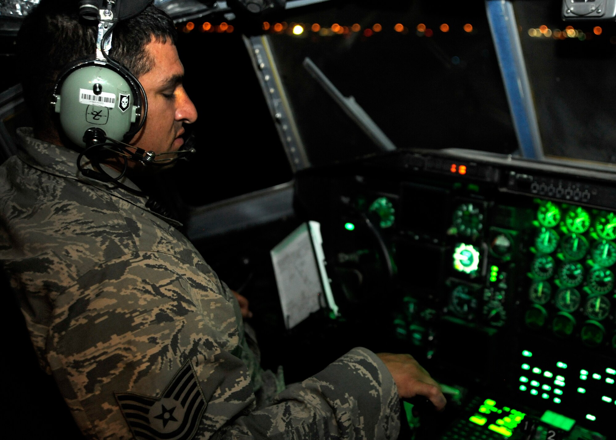 Tech. Sgt. James Romero performs an engine run on a C-130 Hercules at the 379th Air Expeditionary Wing in Southwest Asia, July 29, 2013. Romero is a 746th Expeditionary Aircraft Maintenance Unit crew chief deployed from Peterson Air Force Base, Colo. (U.S. Air Force photo/Senior Airman Bahja J. Jones)