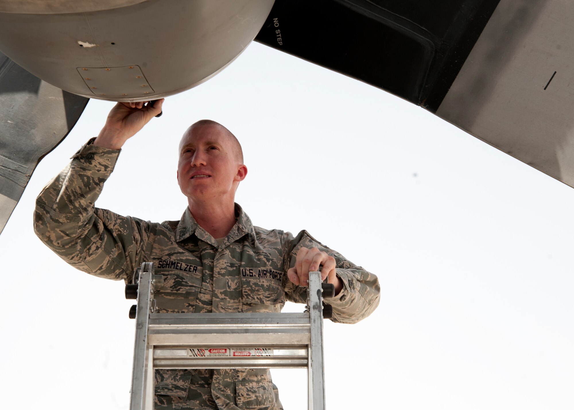 Senior Airman Andrew Schmelzer inspects a C-130 Hercules engine intake during a preflight check at the 379th Air Expeditionary Wing in Southwest Asia, July 31, 2013. Schmelzer is a 746th Expeditionary Aircraft Maintenance Unit aerospace propulsion journeyman deployed from Peterson Air Force Base, Colo. (U.S. Air Force photo/Senior Airman Bahja J. Jones) 