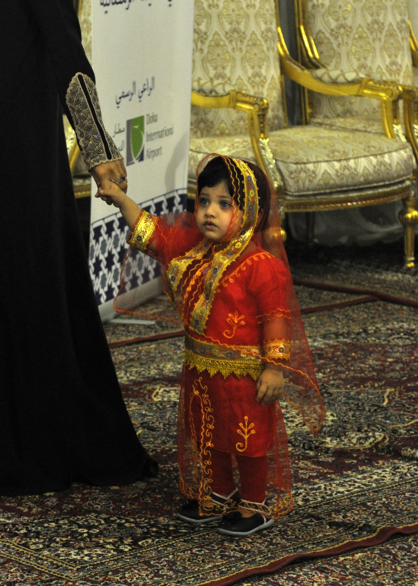 A local girl surveys the room during a “Khaymah Ramadaniyyah” or Ramadan tent celebration hosted by local government officials near the 379th Air expeditionary Wing in Southwest Asia, July 24, 2013. The tent celebration is late evening gathering with snacks that follows the breaking of the fast dinner during the Muslim holy month of Ramadan. (U.S. Air Force photo/1st Lt. Susan Harrington) 