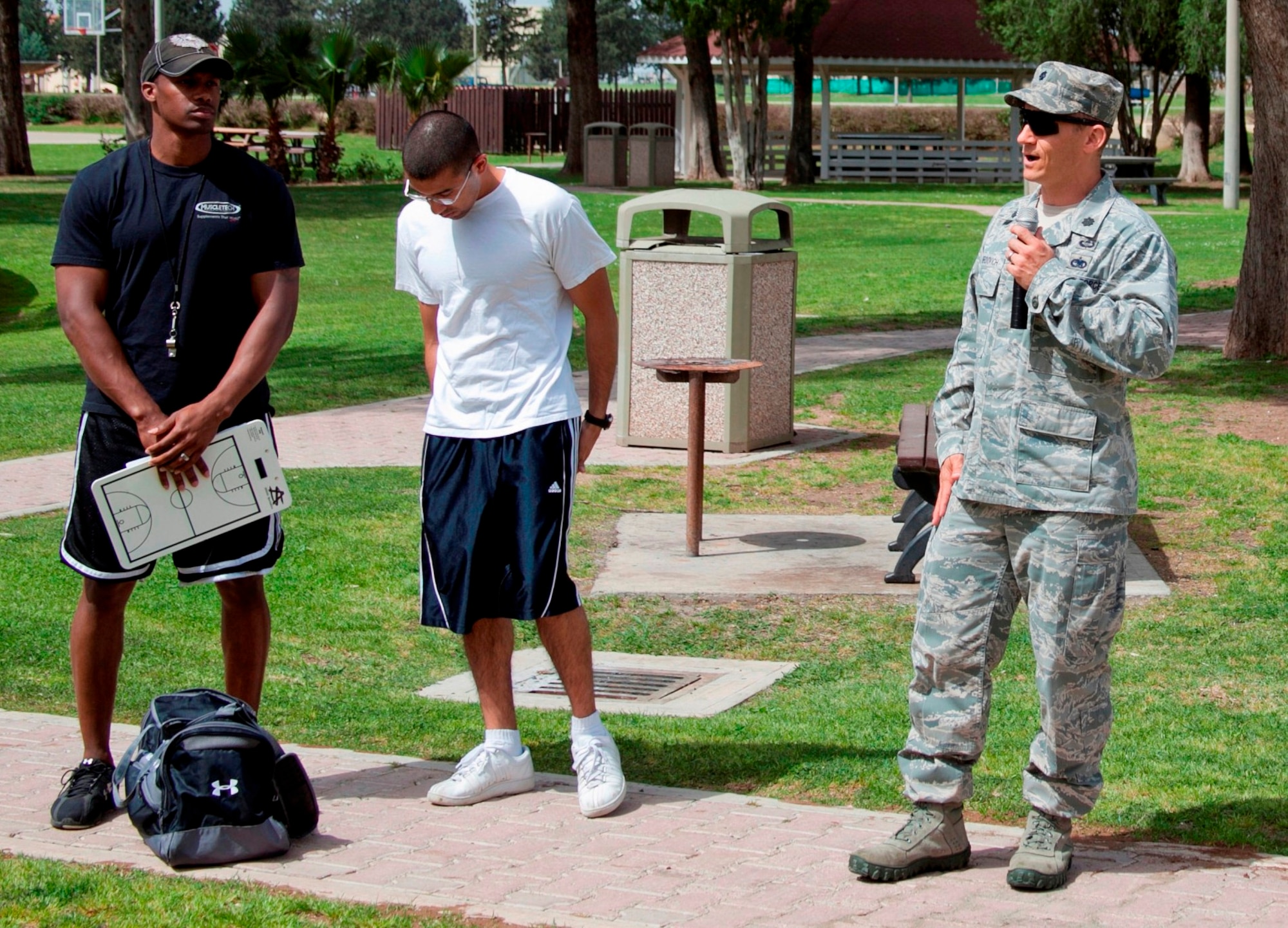 Lt. Col. James Gherdovich, 39th Logistics Readiness Squadron commander, talks with Airmen at a squadron fitness event July 2, 2013, Incirlik Air Base, Turkey. Fitness events are held at Incirlik AB for comraderie and to improve morale. (U.S. Air Force courtesy photo/Released)