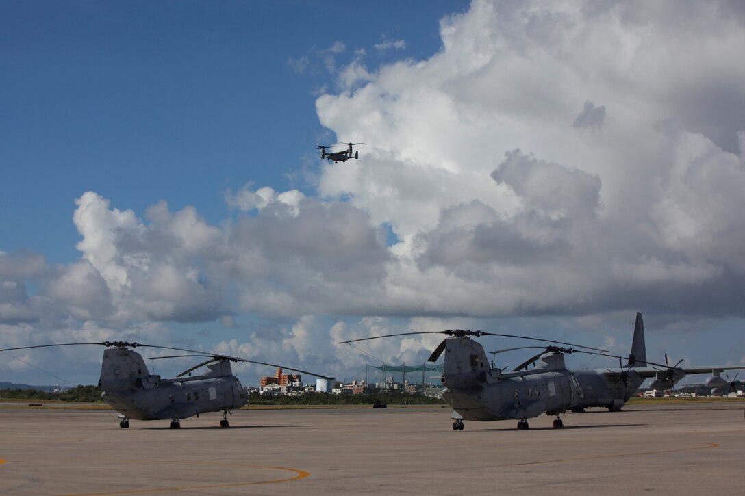 An MV-22B Osprey tiltrotor aircraft arrives at Marine Corps Air Station Futenma Aug. 3. Two Osprey aircraft, part of the second Osprey squadron to Japan, flew from MCAS Iwakuni. The arrival of the second Osprey squadron will complete the one-for-one replacement of the older CH-46E Sea Knight helicopters on Okinawa. The Osprey can fly twice as fast, carry three times the payload, and fly four times the distance of the older CH-46E. Its capabilities significantly benefit the U.S.-Japan alliance and strengthen III Marine Expeditionary Force’s ability to provide for the defense of Japan and perform humanitarian assistance and disaster response missions. The aircraft are part of Marine Medium Helicopter Squadron 262, Marine Aircraft Group 36, 1st Marine Aircraft Wing, III MEF. (U.S. Marine Corps photo by Cpl. Matthew J. Manning/Released)