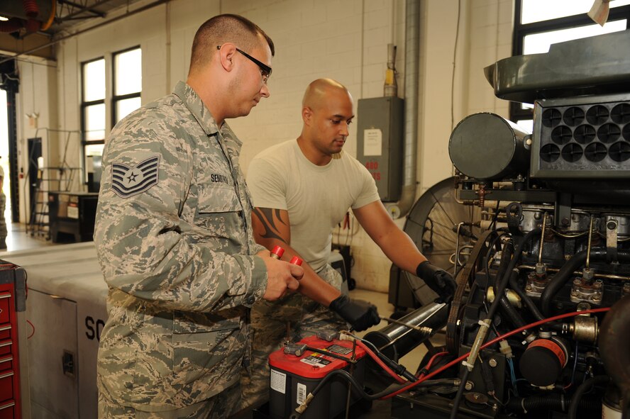 Air Force Tech. Sgt. Scott Sendtko and Senior Airman Cameron Johnson, 927th Maintenance Squadron, repair a self-generating nitrogen cart July 13, 2013, at MacDill Air Force Base, Fla.  The cart converts air to nitrogen and is used to service aircraft tires and struts. 