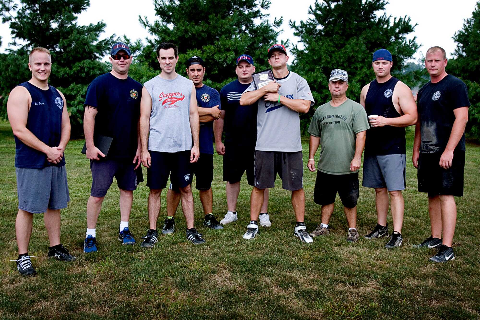 Members of the Grissom Air Reserve Base Fire Department stand with their trophy for winning the base intramural softball championship July 31, 2013. The firefighters put a beat down the 434th Civil Engineer Squadron team 12-2, tapping them out in the 4th inning via the 10-run mercy rule. (U.S. Air Force photo/Tech. Sgt. Douglas Hays)
