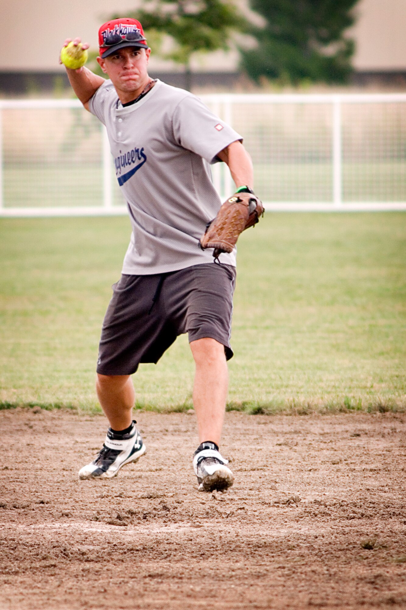 Thomas Carey, Grissom Fire Department shortstop, prepares to gun down a 434th Civil Engineer batter at first base July 31, 2013 during the intramural softball championship. The firemen doused CE 12-2 to claim the Grissom Air Reserve Base, Ind., softball crown. (U.S. Air Force photo/Tech. Sgt. Douglas Hays)