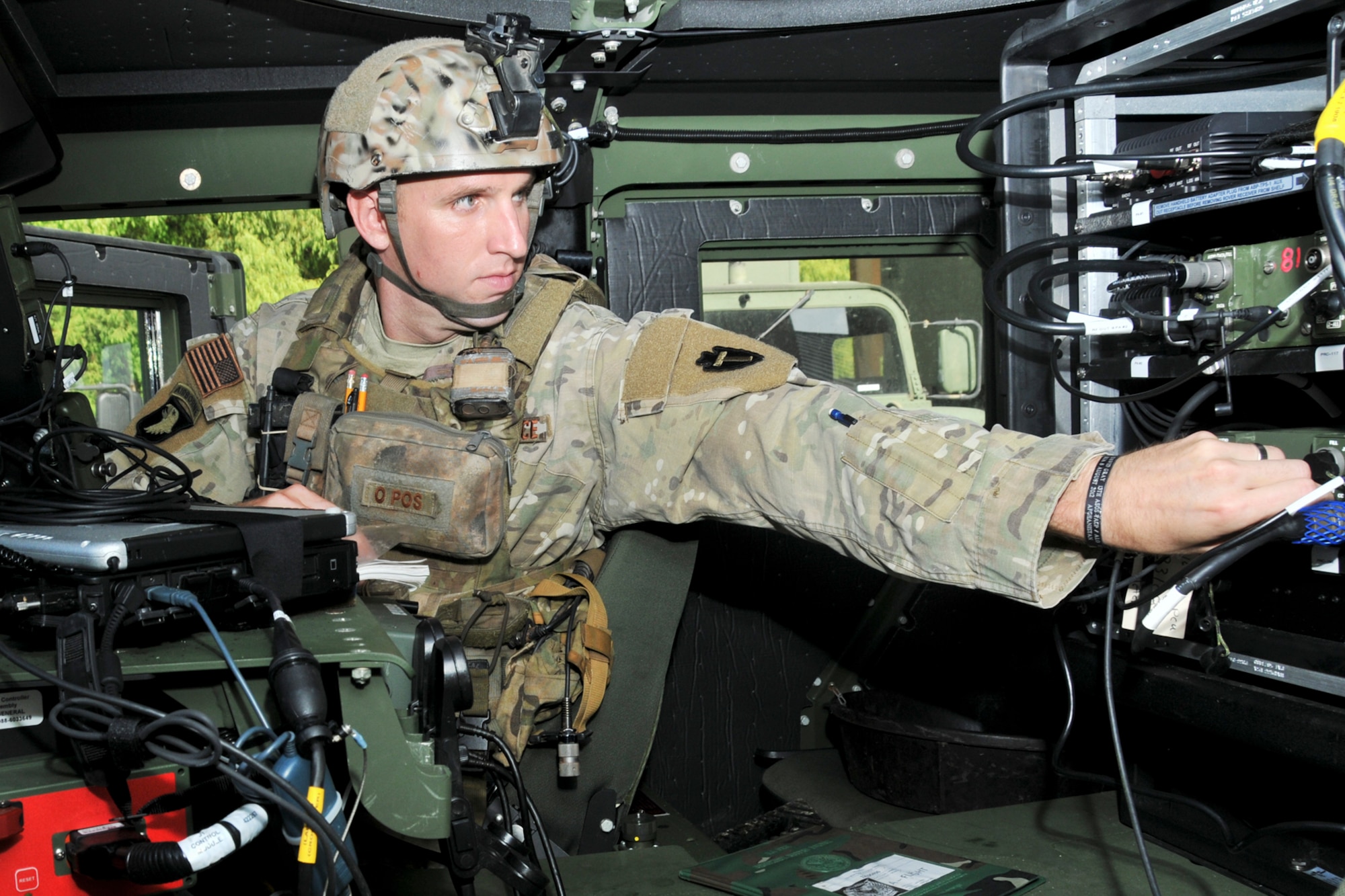 Tech. Sgt. Ryan Erickson, 147th Reconnaissance Wing member, adjusts a radio in a HUMVEE at Ellington Field Joint Reserve Base in Houston.