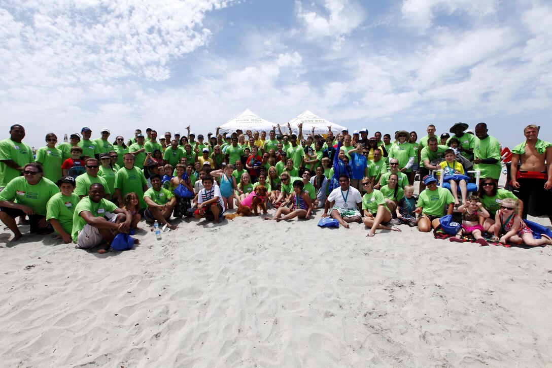 Exceptional Family Members Program members and volunteers with the Orange County Best Day Foundation gather for a group photo after spending the day surfing, body boarding and Kayaking in an effort to build self-esteem and confidence in children at the Del Mar Beach here Aug. 3. 
