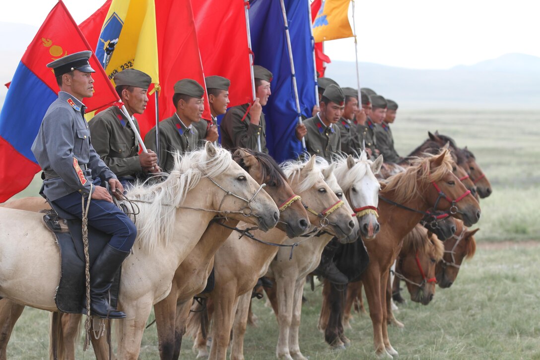 Members of the Mongolian Armed Forces 234 Calvary Unit, prepare to give a demonstration during the opening ceremony of Exercise Khaan Quest in Five Hills Training Area, Mongolia, August 3, 2013. Khaan Quest is an annual multinational exercise sponsored by the U.S. and Mongolia, and it is designed to strengthen the capabilities of U.S., Mongolian and other nations’ forces in international peace support operations.