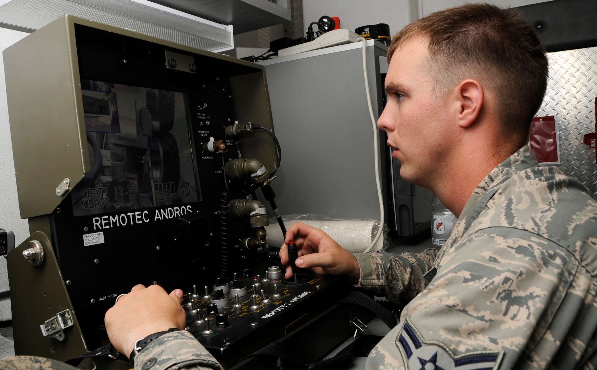 Airman 1st Class Brent Points, 35th Civil Engineer Squadron Explosive Ordnance Disposal apprentice, tests the F6A robot at Misawa Air Base, Japan, Aug. 2, 2013. EOD Airmen use many robotics for reconnaissance during active bomb disposal such as a suspicious package or an Improvised Explosive Device. (U.S. Air Force photo by Airman 1st Class Kaleb Snay)