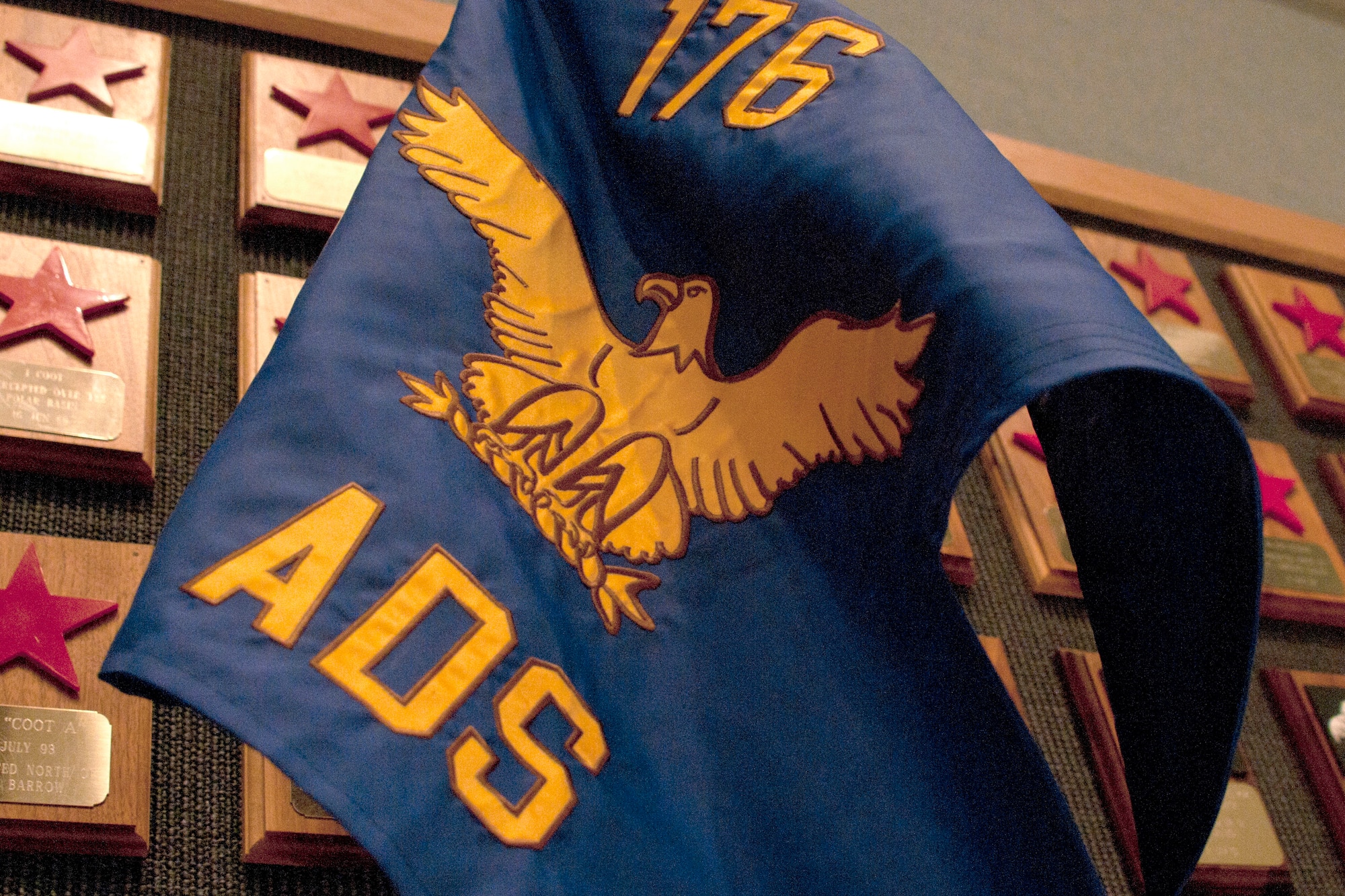 JOINT BASE ELMENDORF-RICHARDSON, Alaska -- Displayed is the new 176th Air Defense Squadron flag. The 176th Air Control Squadron was re-designated to the 176th Air Defense Squadron during a ceremony here Aug. 3. U.S. National Guard photo by Staff Sgt N. Alicia Halla/ Released