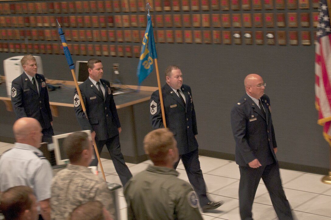 JOINT BASE ELMENDORF-RICHARDSON, Alaska -- The official party of the 176th Air Control Squadron's re-designation ceremony enters here Aug. 3. The new 176th Air Defense Squadron flag remains wound pending its unfurrling during the ceremony. U.S. National Guard photo by Staff Sgt N. Alicia Halla/ Released