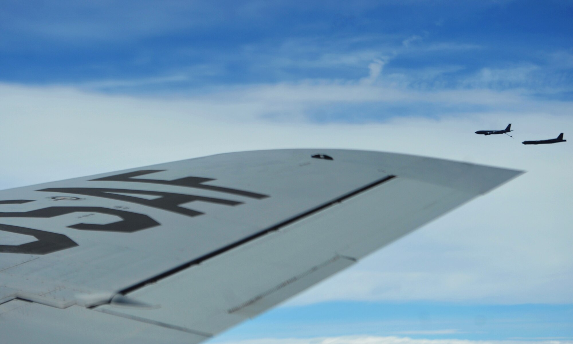 A KC-135 Statotanker from McConnell Air Force Base, Kan. provides fuel to a B-52 Stratofortress from the 307th Bomb Wing, Barksdale Air Force Base, La., during a air-to-air refueling training mission, Aug. 3, 2013. (U.S. Air Force photo by Staff Sgt. Jess Lockoski)