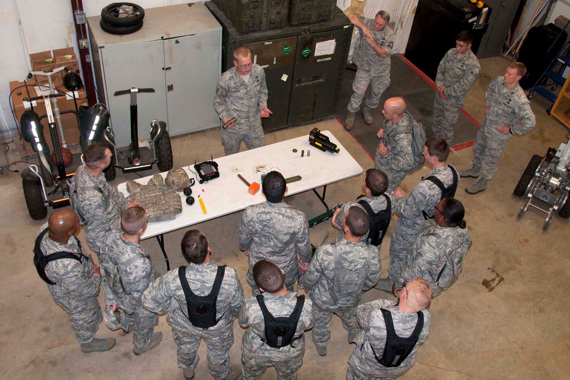 U.S. Air Force chaplain candidates listen to a briefing by a member of the 2nd Bomb Wing explosive ordnance disposal team at Barksdale, Air Force Base, La. Aug. 2, 2013.  EOD team members deploy regularly and derive great benefit from the presence of chaplains in forward locations.  The candidates were able get information directly from the EOD members on how they can best serve members in these forward locations.  (U.S. Air Force photo by Tech. Sgt. Ted Daigle/Released)