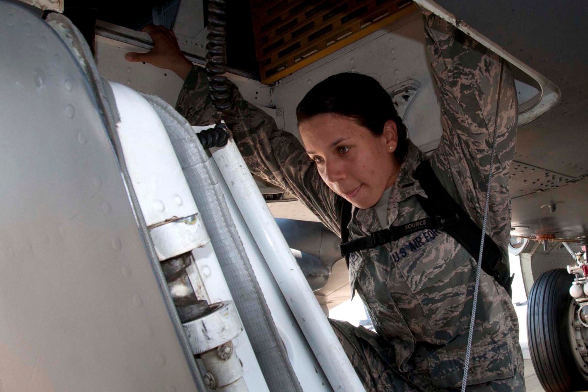 U.S. Air Force Chaplain Candidate 2nd Lt. Iraida Alvarez climbs into the cockpit of a B-52 Stratofortress at Barksdale Air Force Base, La., Aug. 2, 2013.  Alvarez took part in the Chaplain Candidate Intensive Internship, which gives its participants a broad overview of the Air Force.  The 27 candidates in the program learned during the B-52 about the stresses and demand flight crews endure, including extended combat missions and strenuous training flights.  By gaining such a perspective, the candidates can learn how to better serve flight crews in the Air Force.  (U.S. Air Force photo by Tech. Sgt. Ted Daigle/Released)