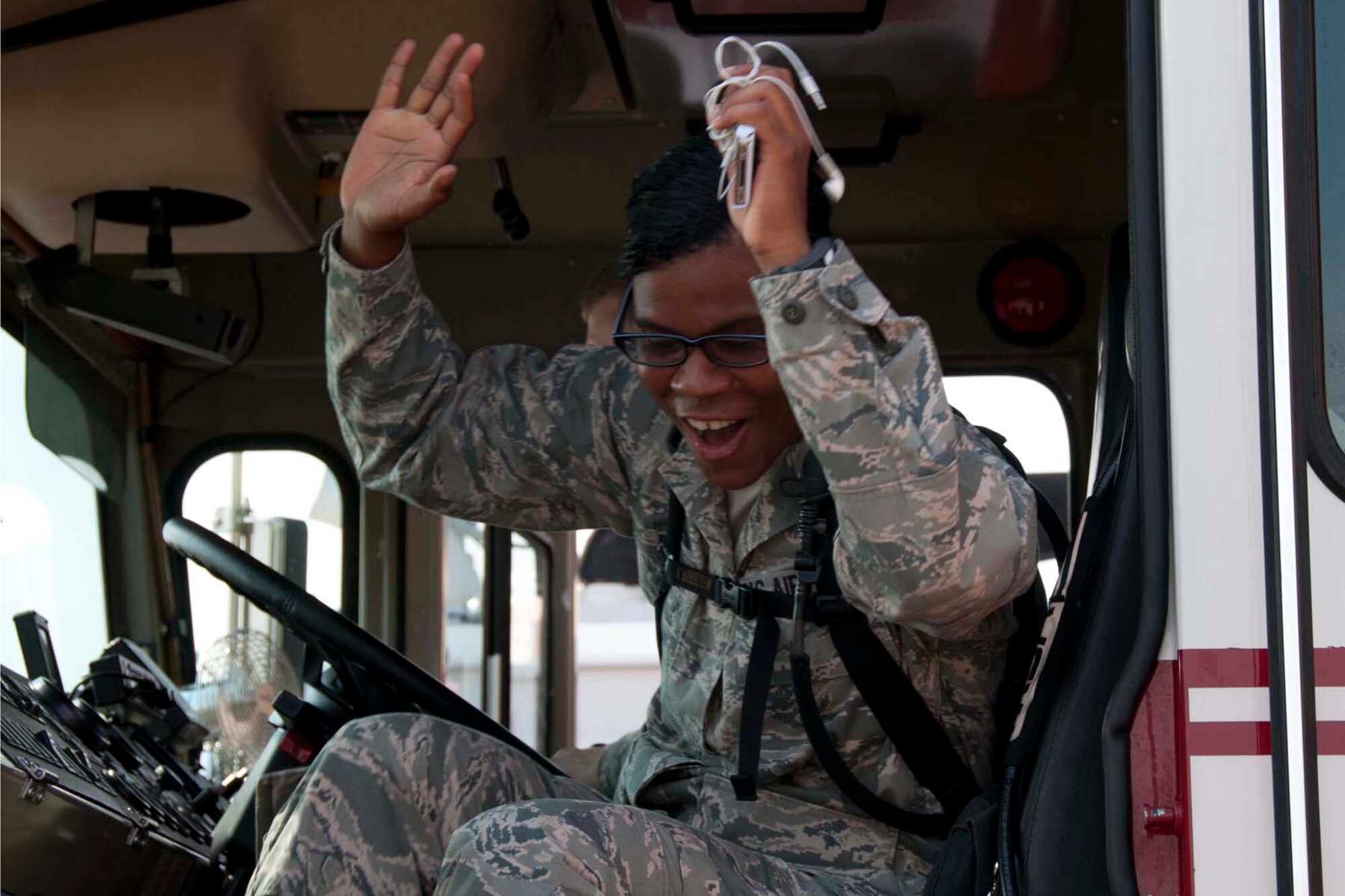 U.S. Air Force Chaplain Candidate 2nd Lt. Xiomara Diaz reacts after firing the water cannon on a fire truck at Barksdale Air Force Base, August 2, 2013.   Diaz and 26 other chaplain candidates visited Barksdale to gain exposure to the different aspects of the Air Force and the unique spiritual needs of different units.  While at 2nd Bomb Wing Fire Station No.1, the candidates gained first-hand knowledge of what the firefighters do and learned how, as chaplains, they could reach out to members involved in the job. (U.S. Air Force photo by Tech. Sgt. Ted Daigle/Released)