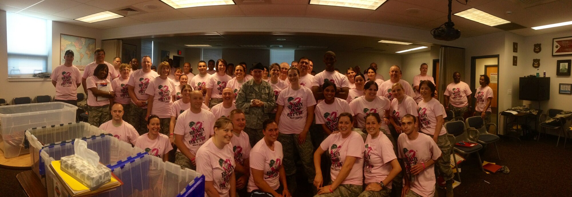 Members of the 914th Aeromedical Staging Squadron don pink shirts to show support for fellow Airman, Master Sgt. Anne Davis, 914th ASTS. Master Sgt. Davis was diagnosed with breast cancer earlier this year and is currently undergoing chemotherapy. (courtesy photo) 