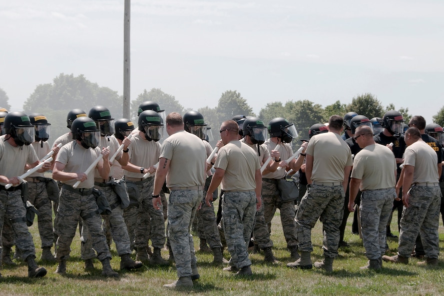 On Saturday, August 3, 2013, members of the 132nd Fighter Wing (132FW), Des Moines, Iowa Security Forces Squadron are seen participating in Riot Control training.  This joint training exercise also involves members of the Iowa State Patrol and the Johnston, Iowa Police Department.  (U.S. Air National Guard photo by Master Sgt. Todd D. Moomaw/Released)