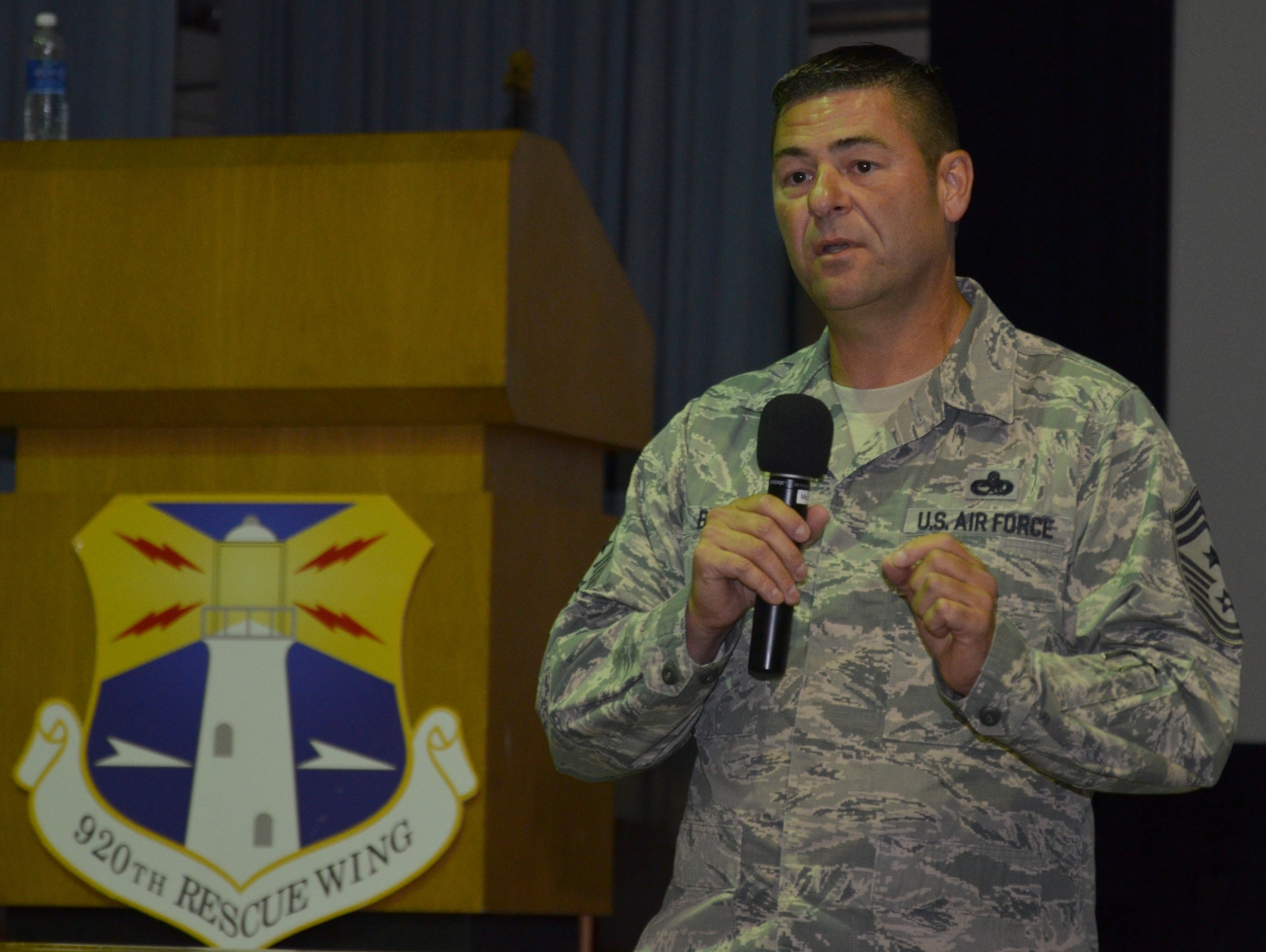Command Chief Master Sgt. Timothy Bianchi, 920th Rescue Wing, speaks to enlisted rescue Airmen at the wing’s enlisted call in the base theater Aug. 4, 2013.