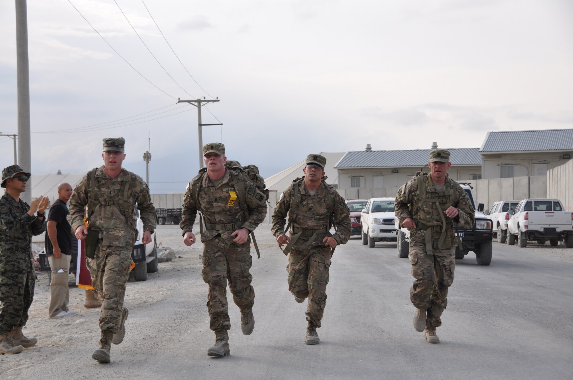 Ninety-two teams participated in the 5-kilometer ‘Got Consent?’ ruck march at Bagram Airfield, Afghanistan, Aug. 3, 2013. The event, hosted by the 455th Air Expeditionary Wing sexual assault response coordinator, was comprised of four-person teams who competed in the march carrying a 30-pound rucksack on their backs. (U.S. Air Force photo/Tech. Sgt. Rob Hazelett)