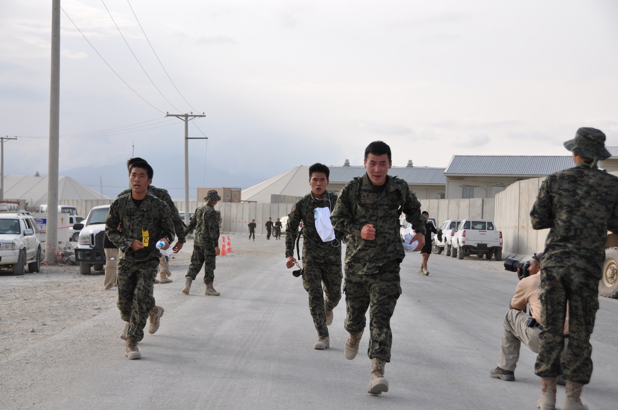 Ninety-two teams participated in the 5-kilometer ‘Got Consent?’ ruck march at Bagram Airfield, Afghanistan, Aug. 3, 2013. The event, hosted by the 455th Air Expeditionary Wing sexual assault response coordinator, was comprised of four-person teams who competed in the march carrying a 30-pound rucksack on their backs. (U.S. Air Force photo/Tech. Sgt. Rob Hazelett)