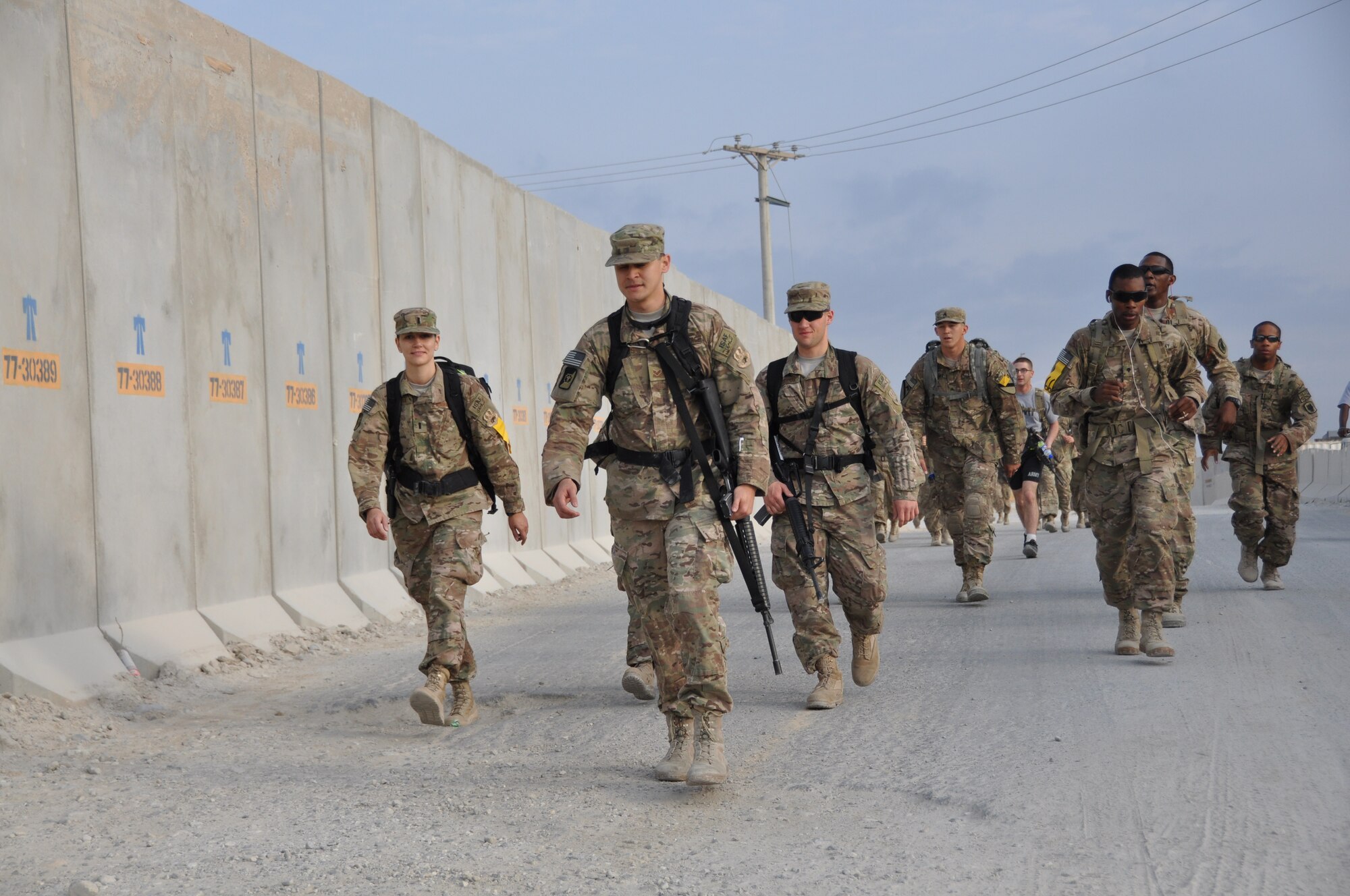 Ninety-two teams participated in the 5-kilometer ‘Got Consent?’ ruck march at Bagram Airfield, Afghanistan, Aug. 3, 2013. The event, hosted by the 455th Air Expeditionary Wing sexual assault response coordinator, was comprised of four-person teams who competed in the march carrying a 30-pound rucksack on their backs. (U.S. Air Force photo/Tech. Sgt. Rob Hazelett)
