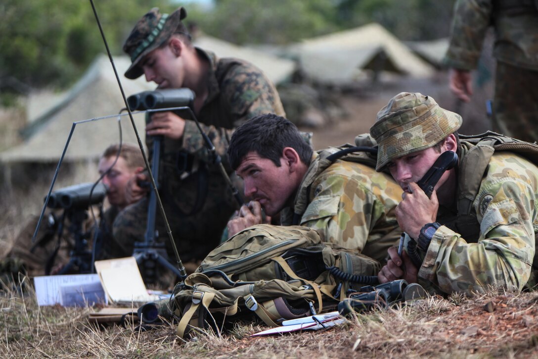 Forward observers from Battalion Landing Team 2nd Battalion, 4th Marines, 31st Marine Expeditionary Unit, and the 107 Battery, 4th Regiment, Royal Australian Artillery, coordinate artillery and mortar fire during a four-day, live-fire exercise following the conclusion of Talisman Saber 13 here, Aug. 3. The live-fire exercise included the coordination of fire-support assets from the 31st MEU; the USS Chung-Hoon, an Arleigh Burke-class AEGIS destroyer; the HMAS Perth III, an ANZAC Class frigate; and the Australian Army. The exercise provided effective and intense training to ensure U.S. and Australian forces are capable, interoperable, deployable on short notice and combat ready. The 31st MEU is the Marine Corps' force in readiness for the Asia Pacific region and the only continuously forward-deployed MEU. 