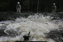 Marines operating a MK III Bridge Erection Boat with Bridge Company, 8th Engineer Support Battalion, 2nd Marine Logistics Group haul an Improvised Ribbon Bridge used during a training exercise at Engineer Point aboard Camp Lejeune, N.C., July 30, 2013. Approximately 44 soldiers with 502nd Multi Role Bridge Company, based at Fort Knox, Ky., worked with Marines to build a continuous span piece-by-piece using 43 IRBs.