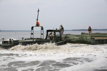 Soldiers with 502nd Multi Role Bridge Company, based at Fort Knox, Ky., operate a MK III Bridge Erection Boat pushing an Improvised Ribbon Bridge during a training exercise at Engineer Point aboard Camp Lejeune, N.C., July 30, 2013. Marines with Bridge Company, 8th Engineer Support Battalion, 2nd Marine Logistics Group worked with soldiers to show them how to utilize the MK III Bridge Erection Boats instead of the MK II BEBs, which they use at Fort Knox. 