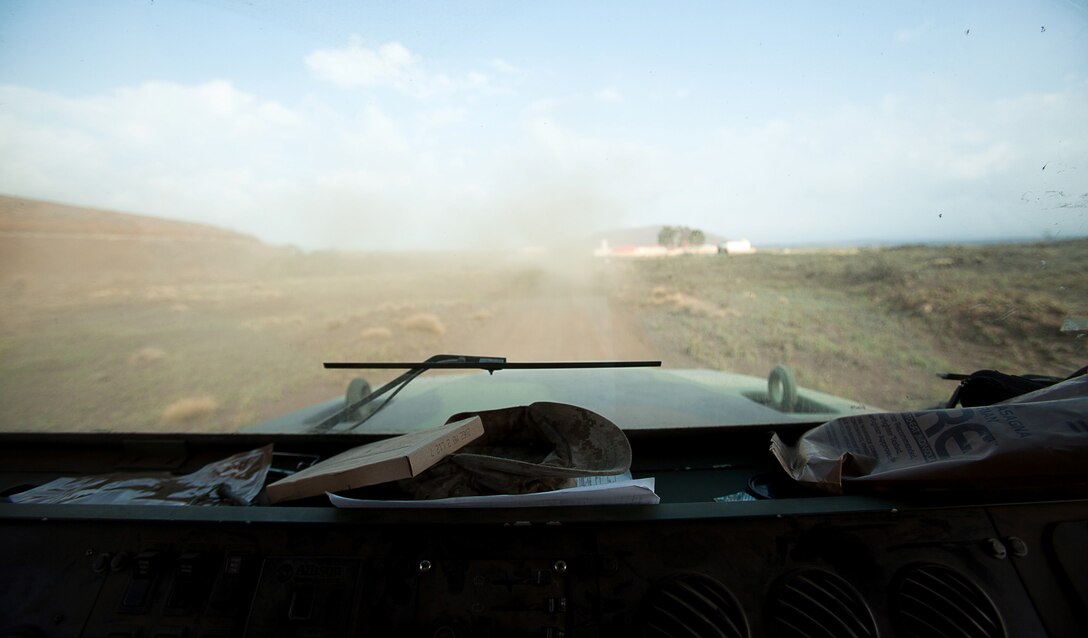 Covers and pre-packaged military rations lay strewn across the dashboard of a 7-ton vehicle. Marines of Combat Logistics Battalion 3 spent long hours driving all across Pohakuloa Training Area, Hawaii in support of 2nd Battalion, 3rd Marine Regiment for Exercise Lava Viper, July 23, 2013. Lava Viper is a battalion-level combined-arms exercise designed to enhance the capabilities of participating Marines who are part of the ground combat and support element. (U.S. Marine Corps photo by Cpl. Matthew Callahan)