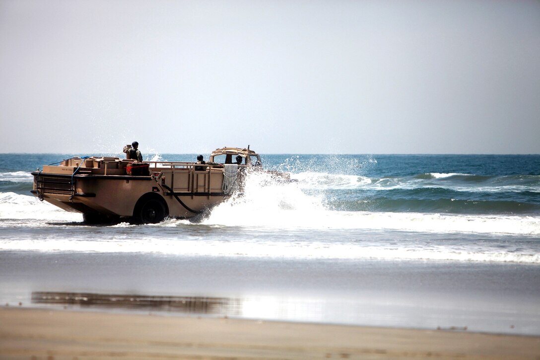 A Light Amphibious Resupply Craft storms the beach when Combat Logistics Battalion 7, Combat Logistics Regiment 1, 1st Marine Logistics Group, conducted an embarkation exercise aboard Camp Pendleton, Calif., July 18, 2013. This is the first time in a decade the battalion, which is based out of Marine Corps Air Ground Combat Center in Twentynine Palms, Calif., has conducted a battalion FEX outside of Twentynine Palms.
