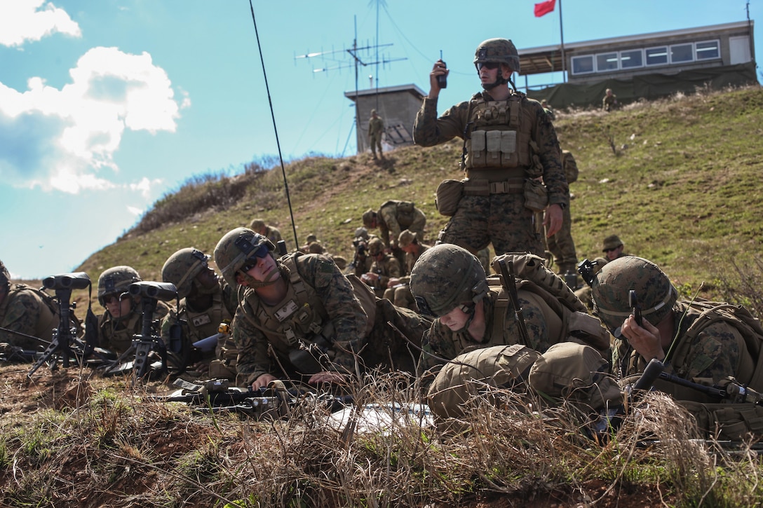 Marines of the Echo Co. fire support team, Battalion Landing Team 2nd Battalion, 4th Marines, 31st MEU, coordinate artillery and mortar fire during a four-day, live-fire exercise following the conclusion of Talisman Saber 13 here, July 31. The live-fire exercise included the coordination of fire-support assets from the 31st MEU; the USS Chung-Hoon, an Arleigh Burke-class AEGIS destroyer; the HMAS Perth III, an ANZAC Class frigate; and the Australian Army. The exercise provided effective and intense training to ensure U.S. and Australian forces are capable, interoperable, deployable on short notice and combat ready. The 31st MEU is the Marine Corps' force in readiness for the Asia Pacific region and the only continuously forward-deployed MEU. 