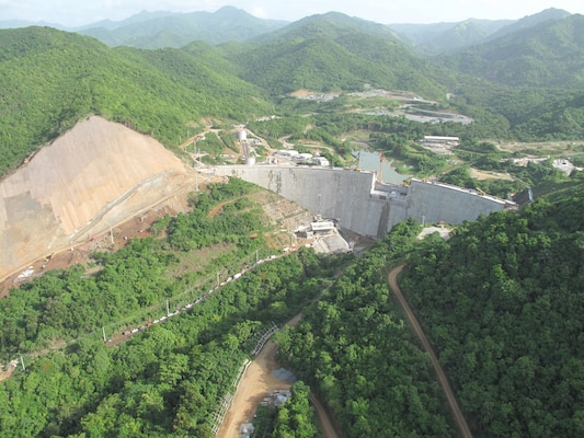Portugués Dam (looking upstream) now fills the river valley as it nears completion near Ponce, Puerto Rico. Construction is expected to wrap up by the end of the year, with operational testing taking place for most of 2014. 