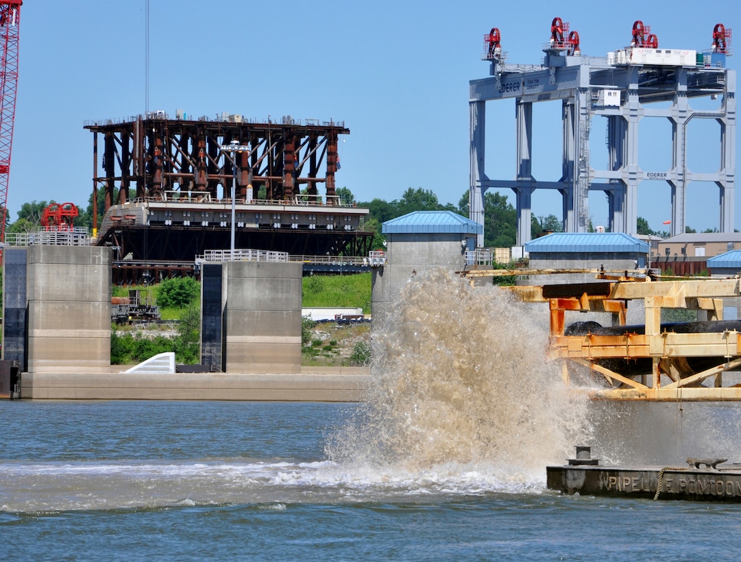 Surface-discharged material removed by the Dredge Hurley from the Olmsted dam footprint means Sill Shell 5 in the background to the left is closer to being placed in the tainter-gate section.