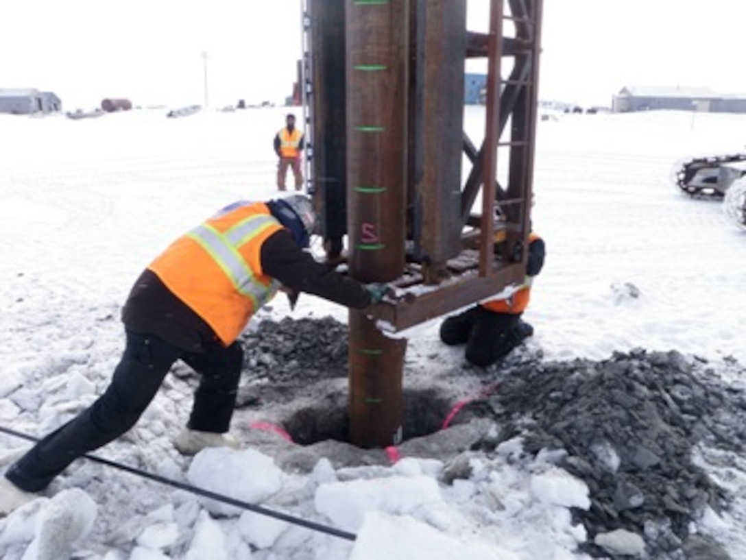 A contractor helps install a mooring point in rural Alaska. To date, the Corps has completed nine of 26 mooring point installations in places such as Chevak, Kwigillingak and Tuntutuliak. The average cost per mooring point is $21,097. (Courtesy Photo)