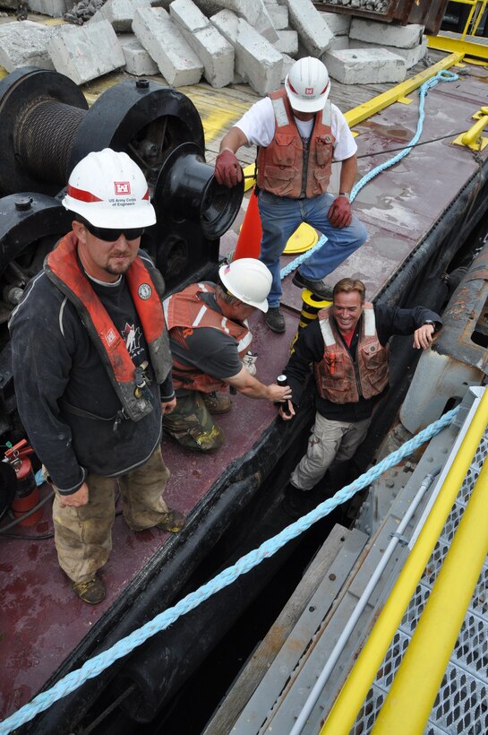 The hard working crew of the U.S. Army Corps of Engineers Buffalo District Floating Plant spent time doing repairs to the Black Rock Lock, Buffalo, NY July 2, 2103.   Repairs included fixing holes in sheet metal and cutting access holes to inspect and repair the lock gate greasing mechanism.