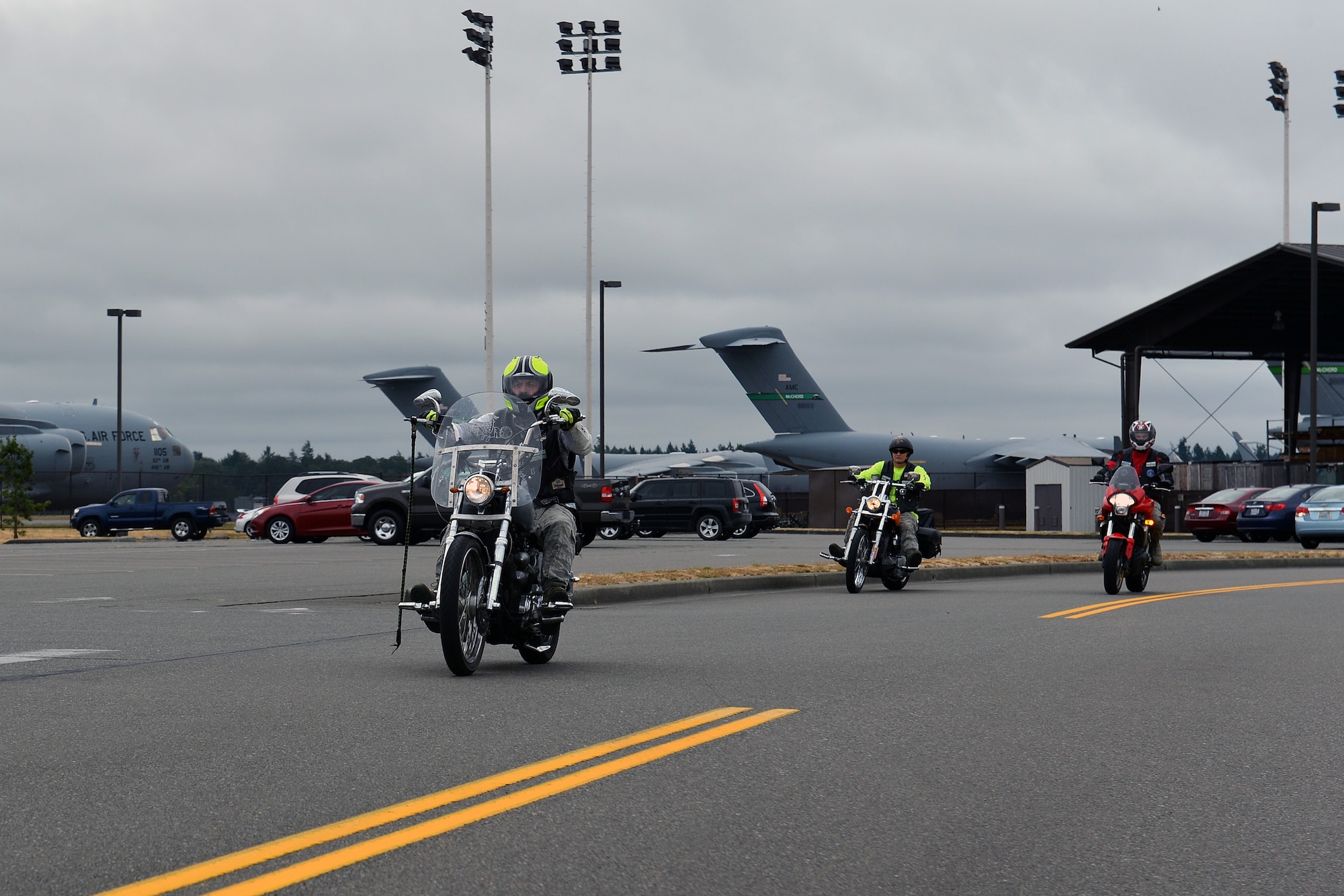 Airmen from the Green Knights Military Motorcycle Club Chapter 3 ride as a group Aug. 1, 2013 at Joint Base Lewis-McChord, Wash. Since 2012, the group has helped support and raise money for organizations like “Bikers Against Statewide Hunger” and “Toys for Tots” through group rides. (U.S. Air Force photo/Airman 1st Class Jacob Jimenez)   