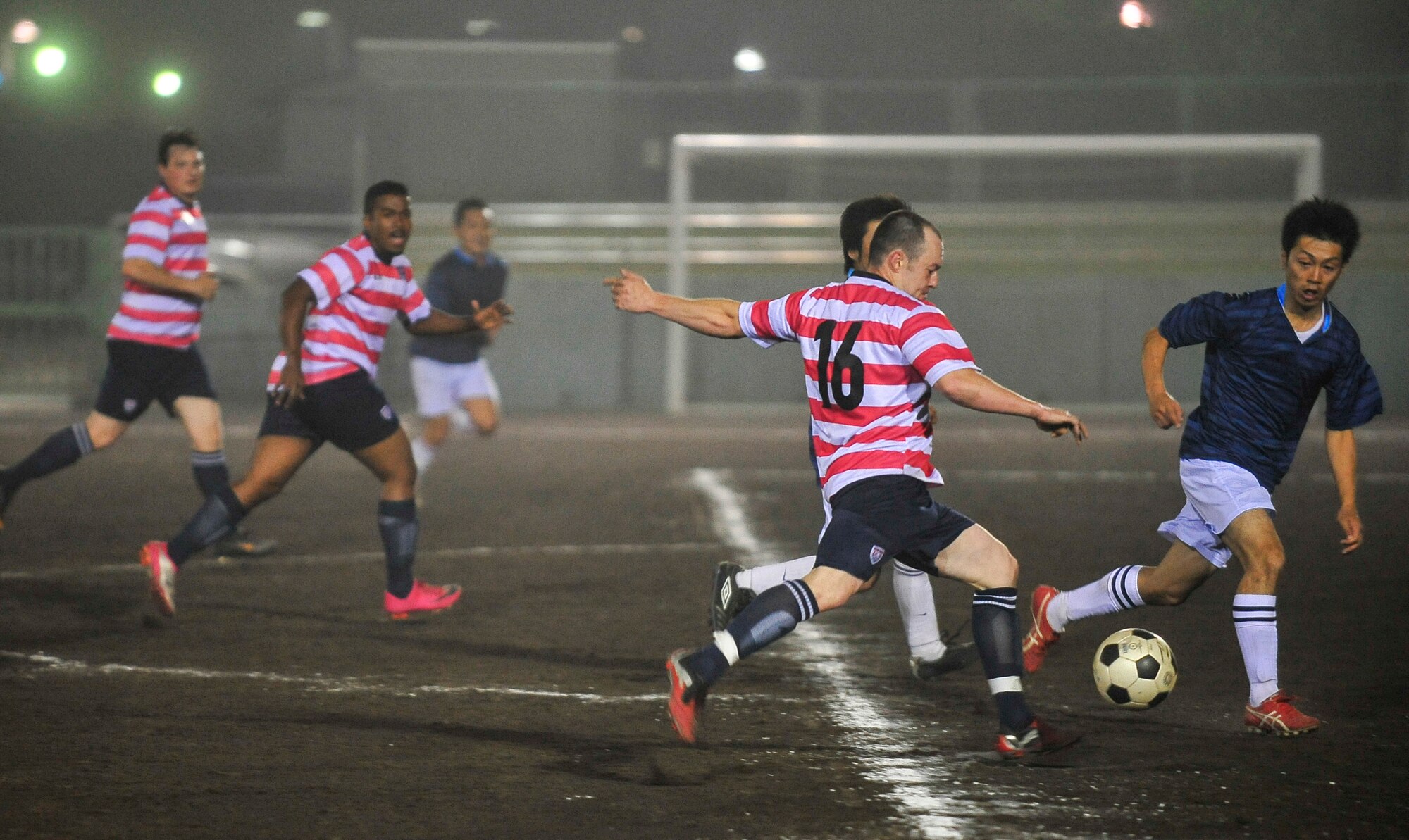 Senior Airman Marcus Niemann, 35th Civil Engineer Squadron, attempts a shot during a soccer game in Misawa City, Japan, July 24, 2013. The key ingredient to an injury-free workout is taking part in a warm-up that emulates the activity you plan to partake in. (U.S. Air Force photo/Staff Sgt. Nathan Lipscomb)