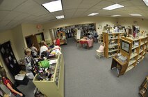 Volunteers at the thrift shop sort through and organize items at the store at Fairchild Air Force Base, Wash., Aug. 1, 2013. The base thrift shop is open to anyone with base access and offers an array of high quality items at a low cost. (U.S. Air Force photo by Senior Airman Mary O'Dell/Released)